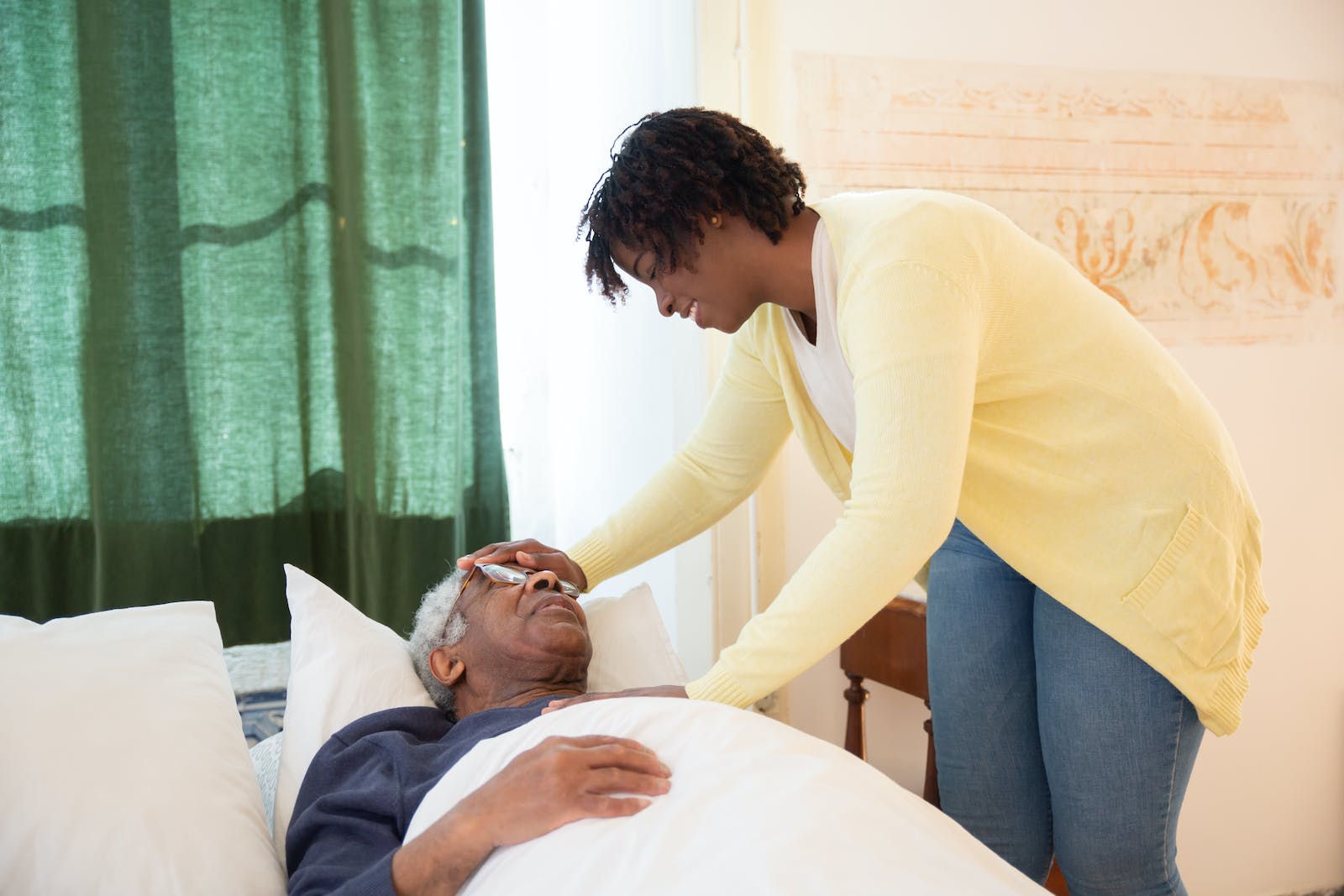 Woman Touching Elderly Mans Head Healing Touch for Seniors