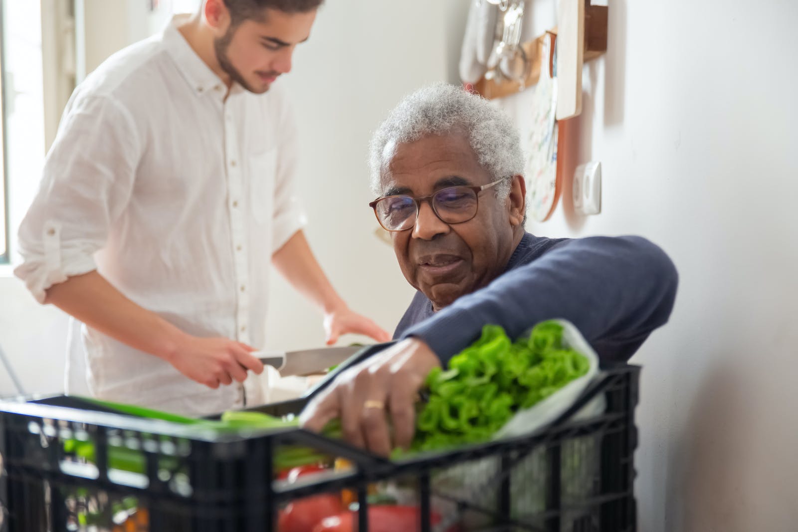 An Elderly Man Holding Leafy Vegetables Hiring In-Home Help for Senior Care