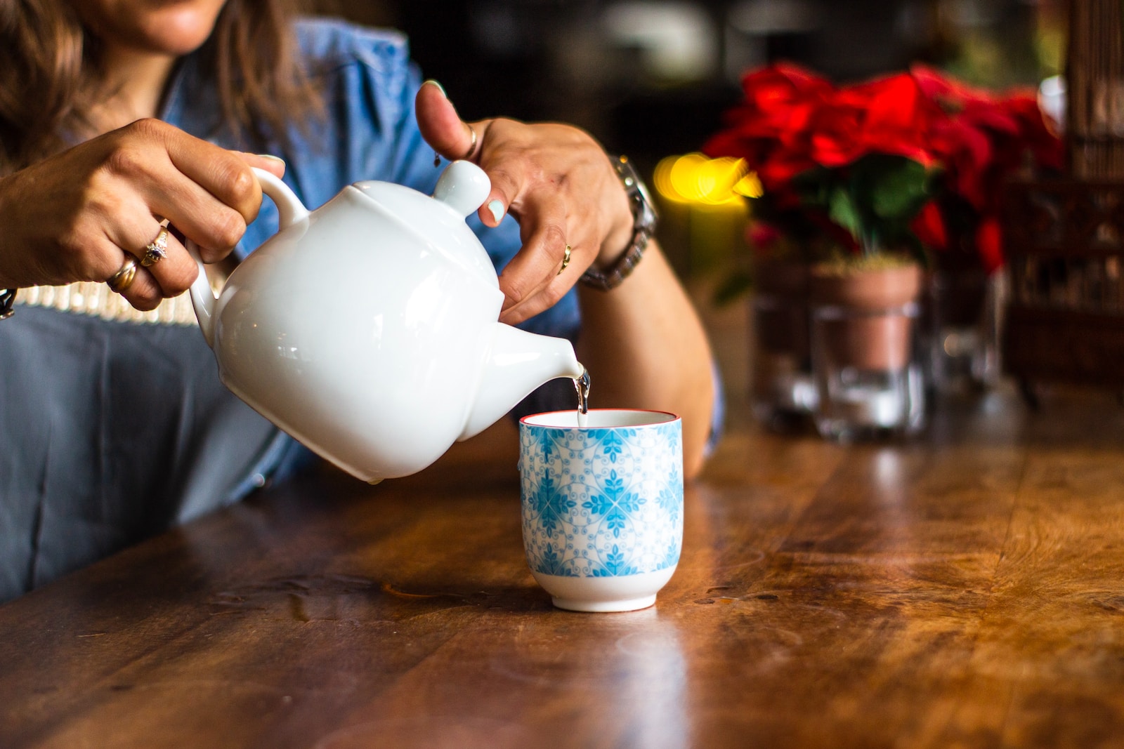 unknown person holding white ceramic kettle Homeopathy for Seniors