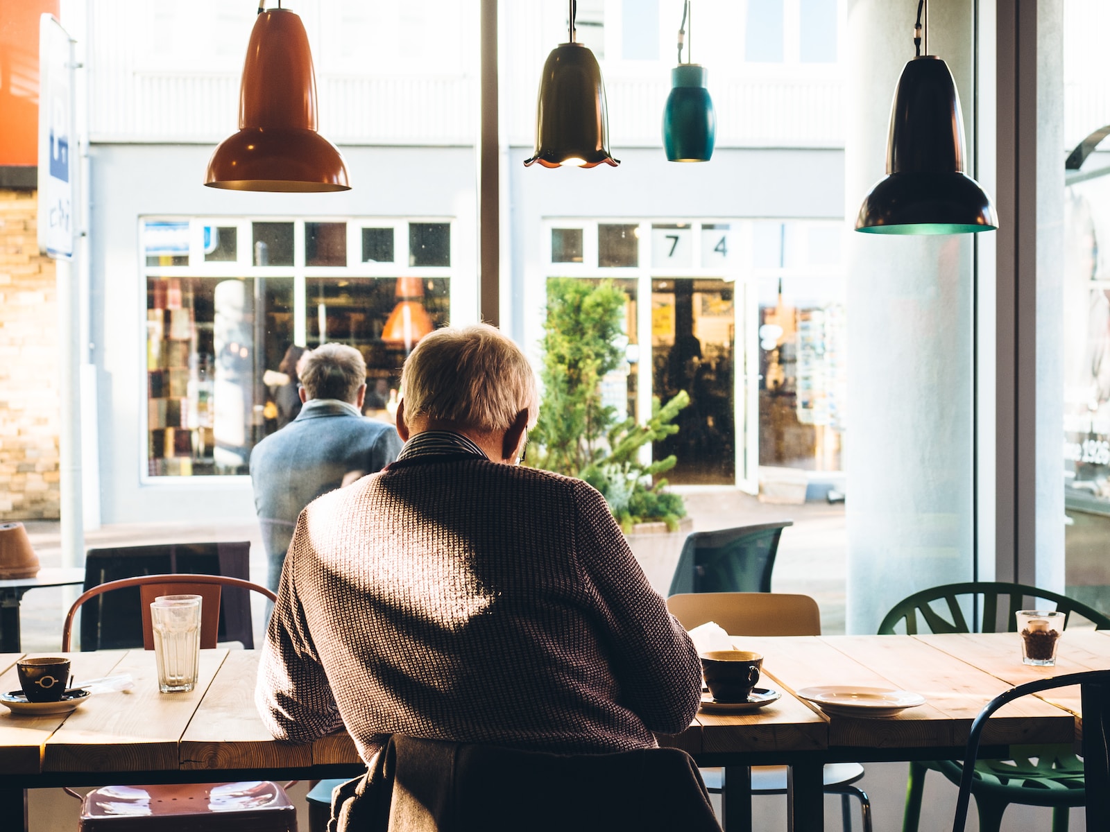man in chair with table beside coffee Mindfulness Practices Into Senior Care