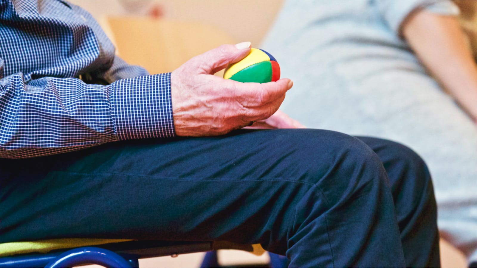Person Holding Multicolored Ball Reflexology to Improve Senior Health