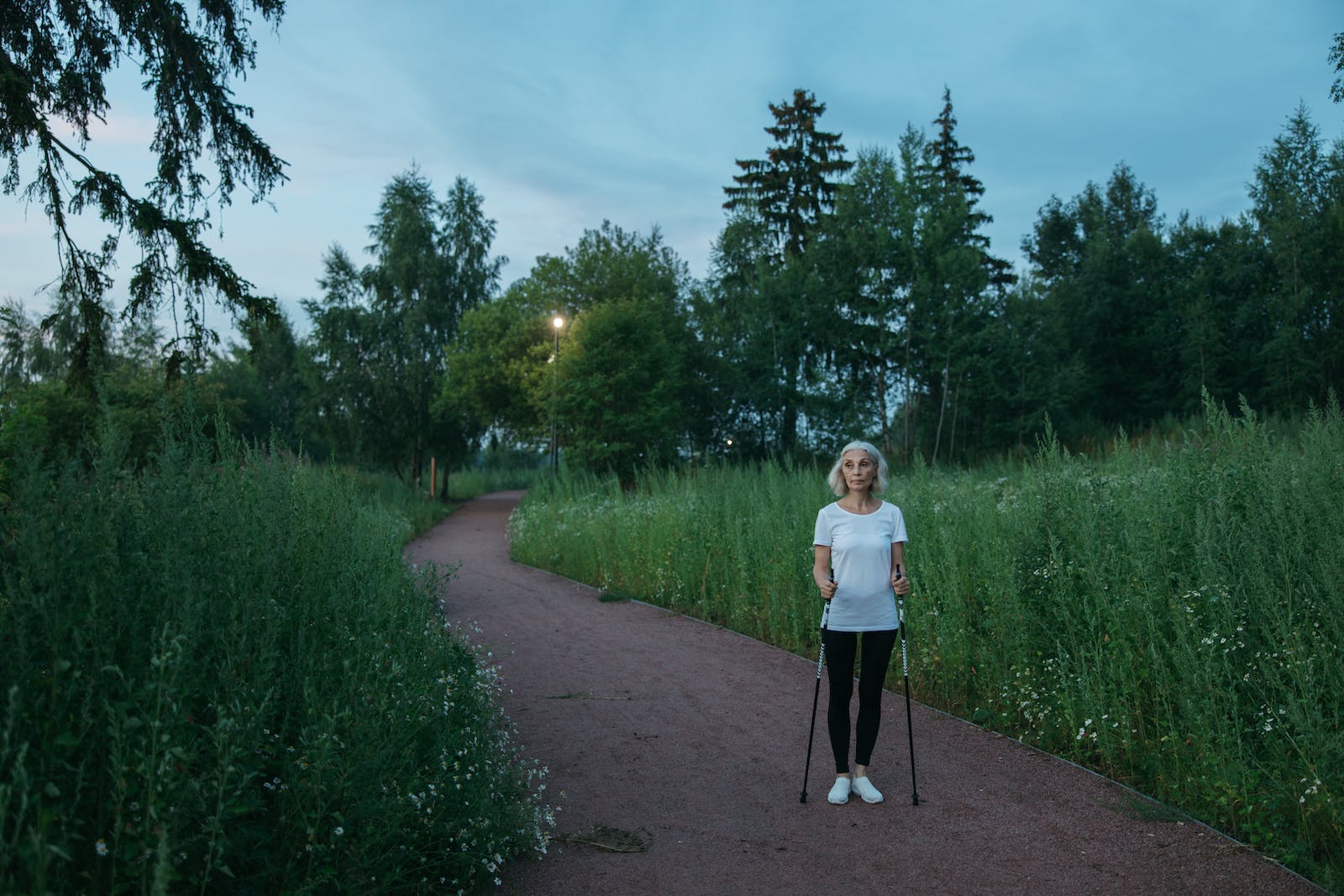 Elderly Woman walking on a Park Walking for Senior Health